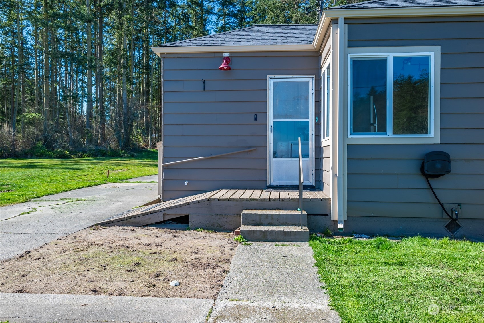 1932 Zylstra Road Oak Harbor, WA 98277 - Photo 5 of 40 a front view of a house with a yard