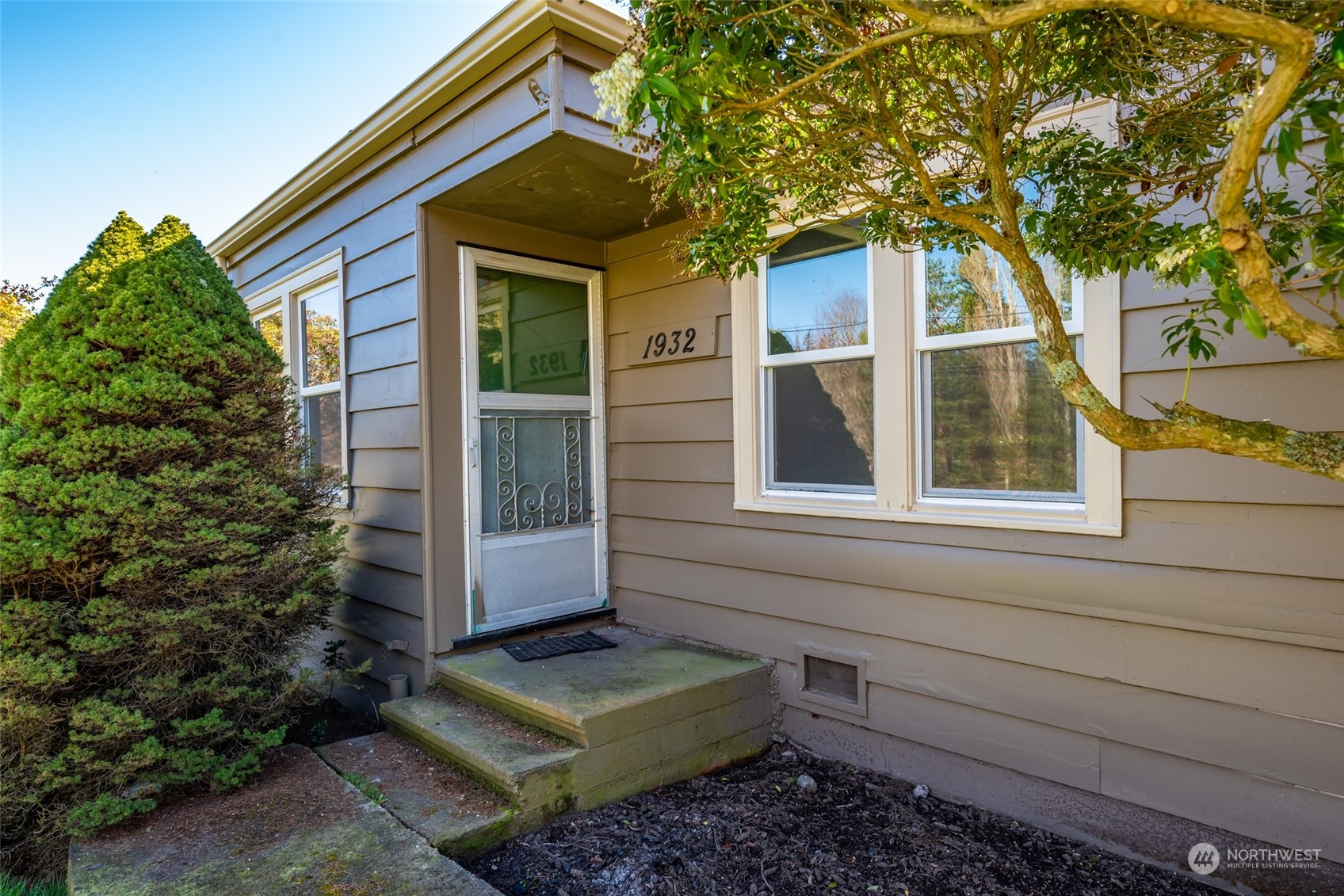 1932 Zylstra Road Oak Harbor, WA 98277 - Photo 6 of 40 a view of house with a yard and potted plants