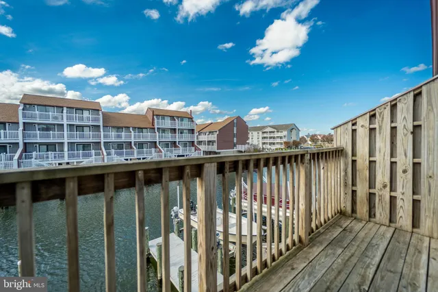 a view of a balcony with wooden floor