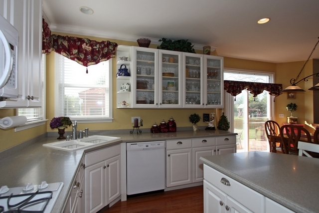 1560 Southgate Road Bartlett, IL 60103 - Photo 4 of 25 a kitchen with a sink a window and cabinets