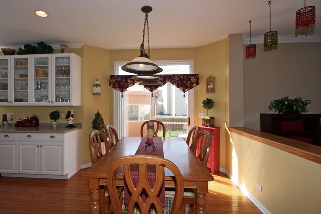 1560 Southgate Road Bartlett, IL 60103 - Photo 6 of 25 a view of a dining room with furniture and chandelier