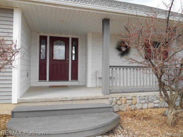 8778 West Sherwood Road Fowlerville, MI 48836 - Photo 2 of 20 Trex and Cement Front Porch