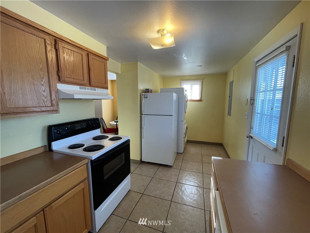 65 F Street Northeast Ephrata, WA 98823 - Photo 11 of 15 a kitchen with a cabinets and wooden floor