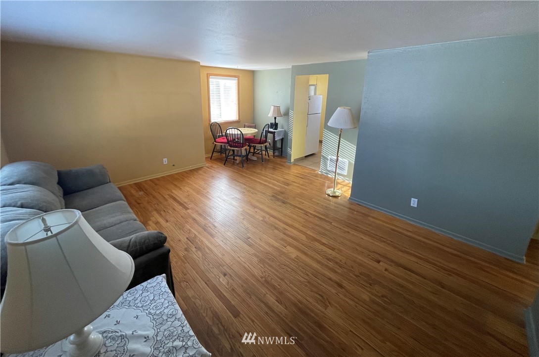 65 F Street Northeast Ephrata, WA 98823 - Photo 3 of 15 a living room with furniture and a wooden floor