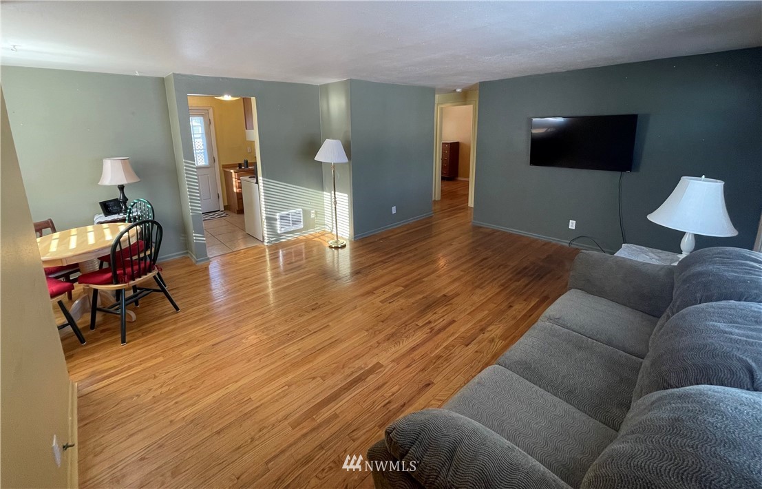 65 F Street Northeast Ephrata, WA 98823 - Photo 4 of 15 a living room with furniture and a flat screen tv