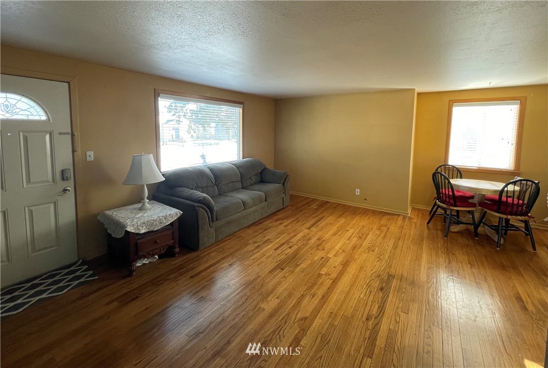 65 F Street Northeast Ephrata, WA 98823 - Photo 6 of 15 a living room with furniture and a wooden floor