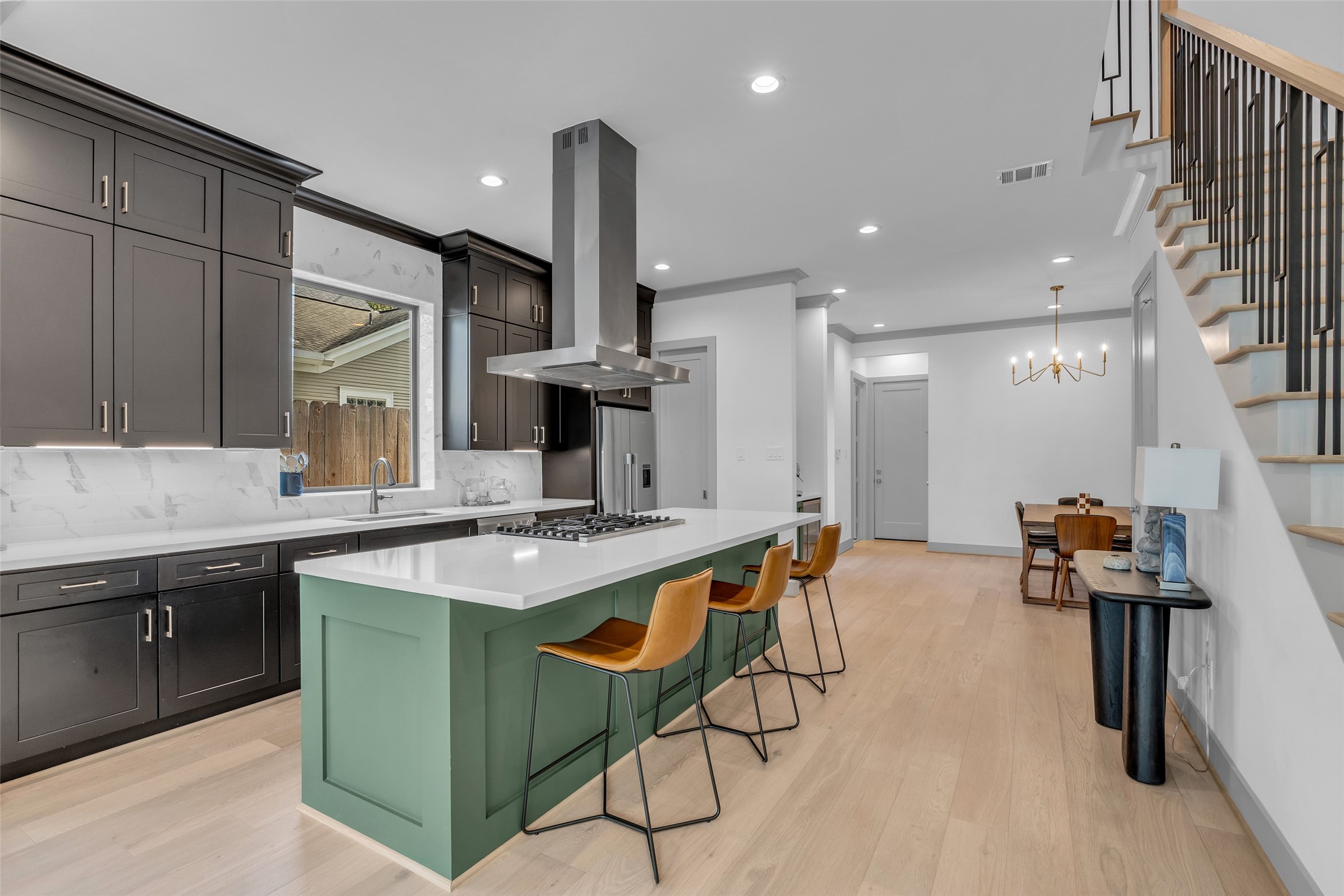 1724 Ridgewood Street Houston, TX 77006 - Photo 2 of 38 As you step inside, the kitchen is conveniently located to your right, providing an efficient layout that's perfect for everyday living and entertaining.