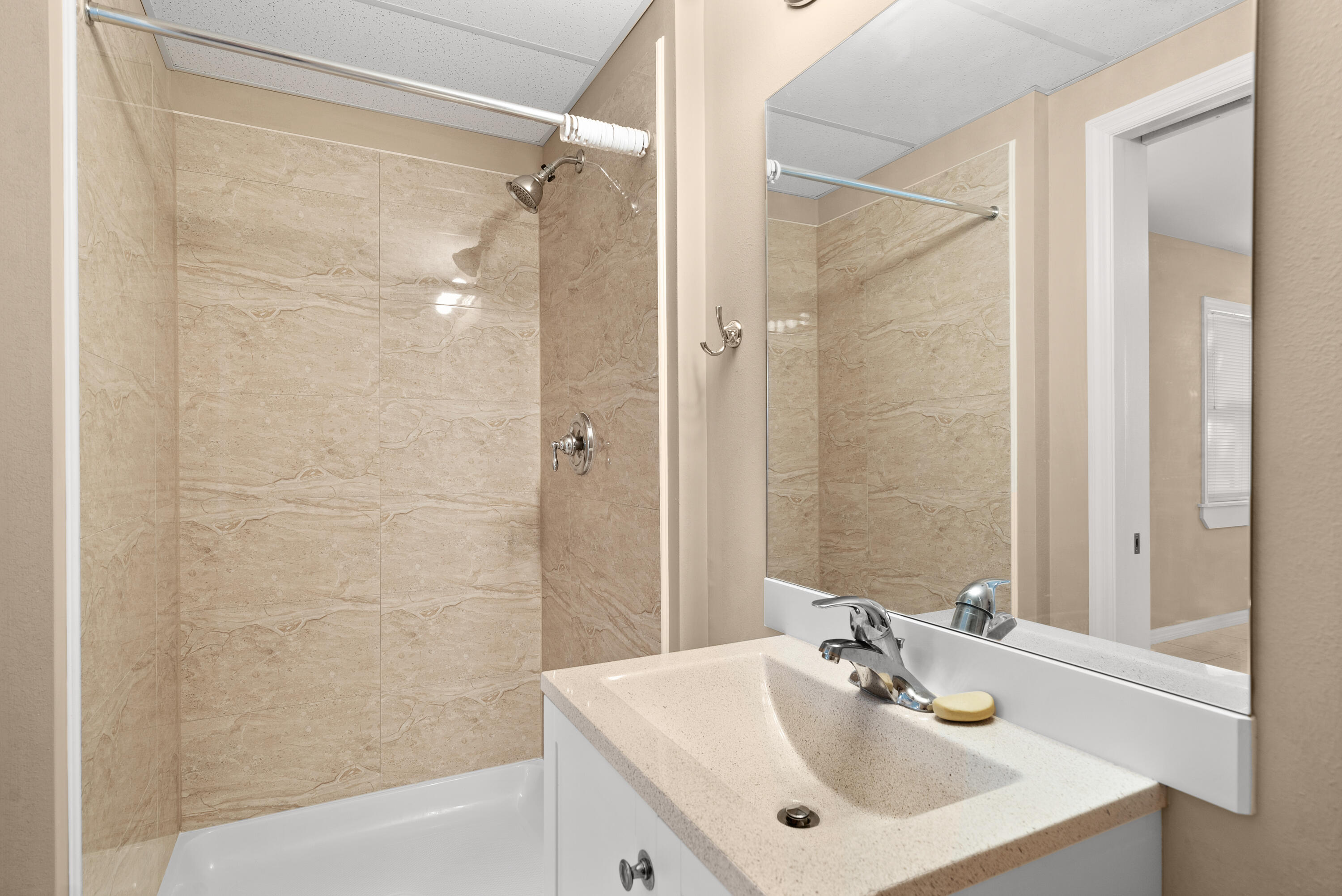 85 Holiday Boulevard Key Largo, FL 33037 - Photo 12 of 20 a bathroom with a sink mirror and shower