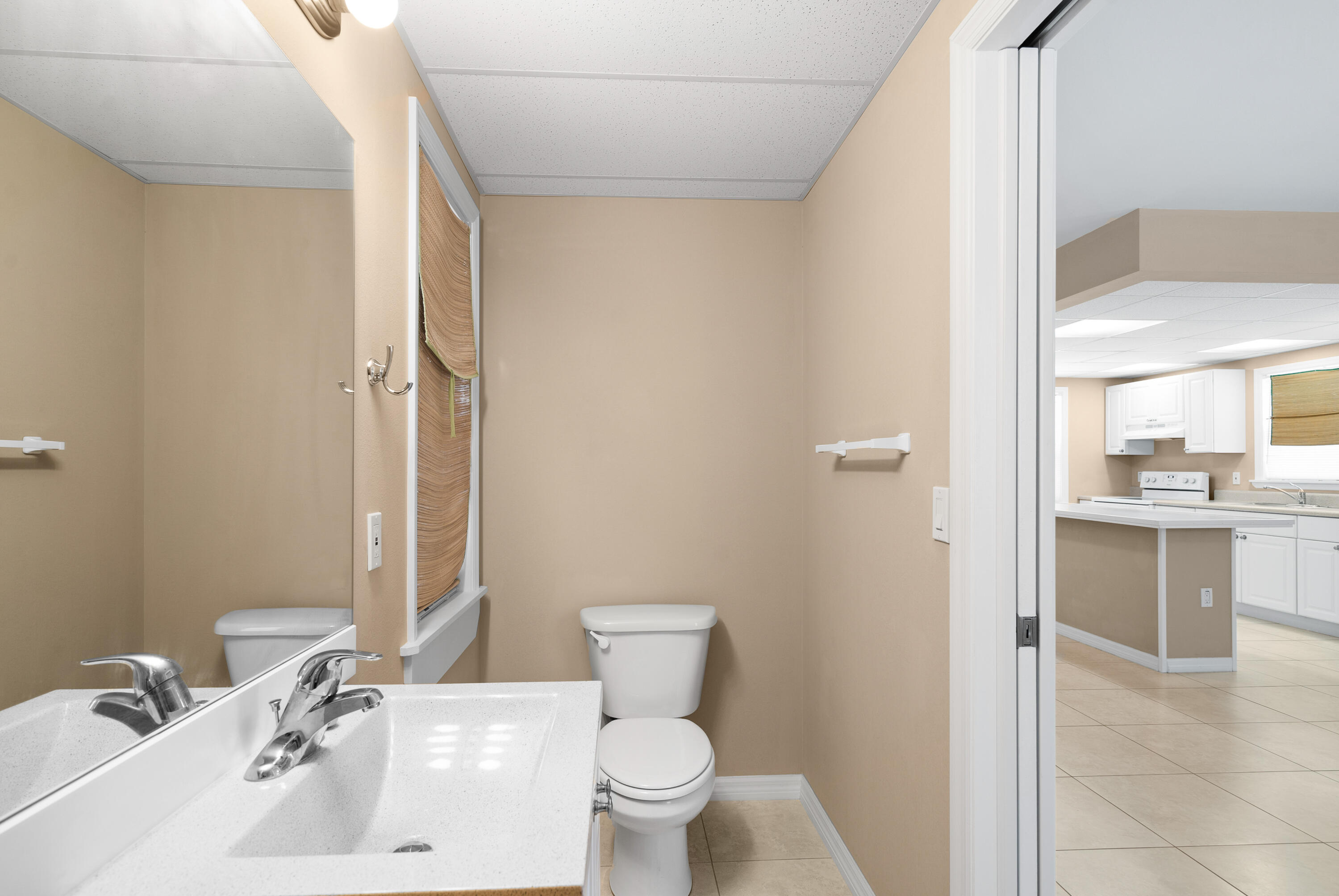 85 Holiday Boulevard Key Largo, FL 33037 - Photo 13 of 20 a bathroom with a sink toilet vanity and tub