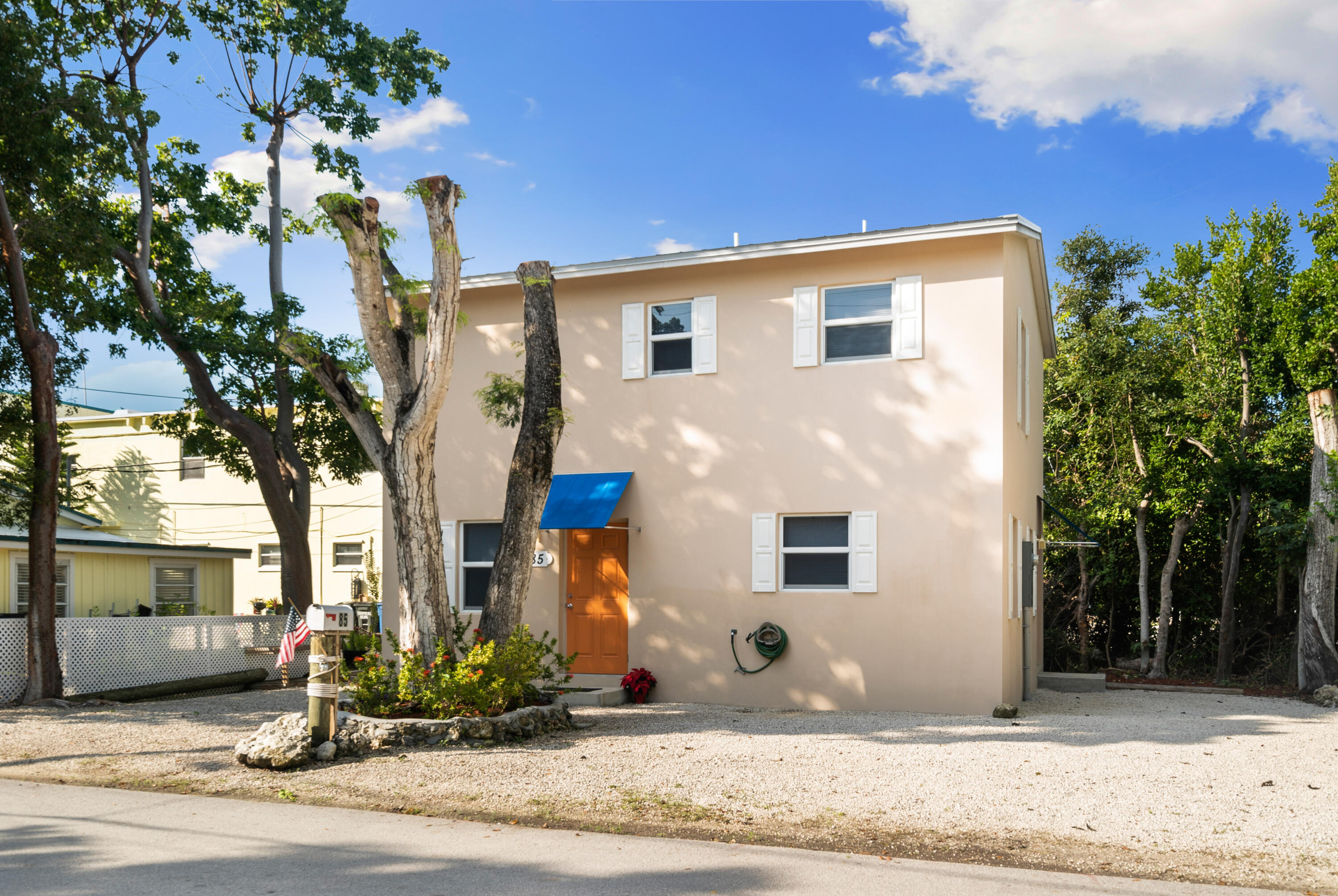 85 Holiday Boulevard Key Largo, FL 33037 - Photo 18 of 20 a front view of a house with a yard