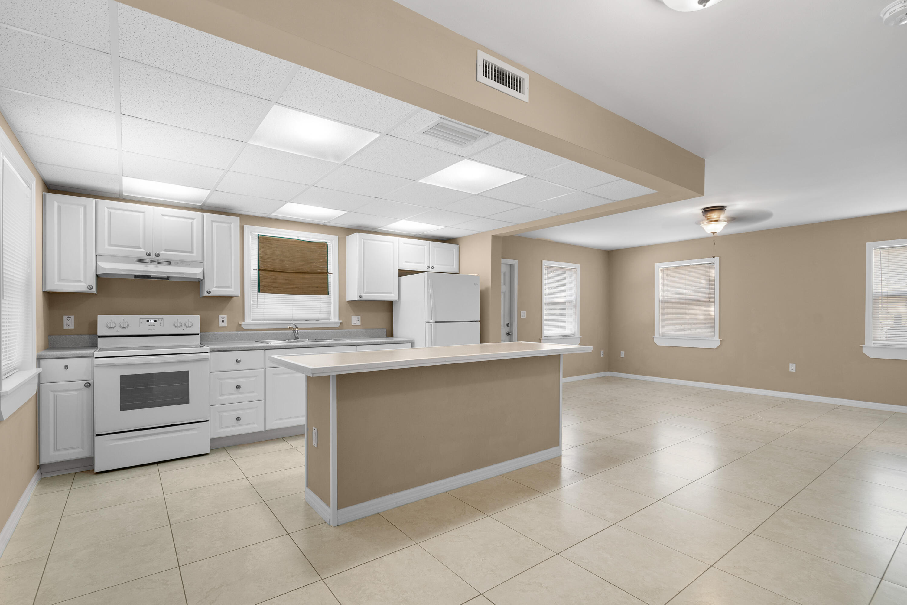 85 Holiday Boulevard Key Largo, FL 33037 - Photo 2 of 20 a kitchen with a stove top oven sink and cabinets