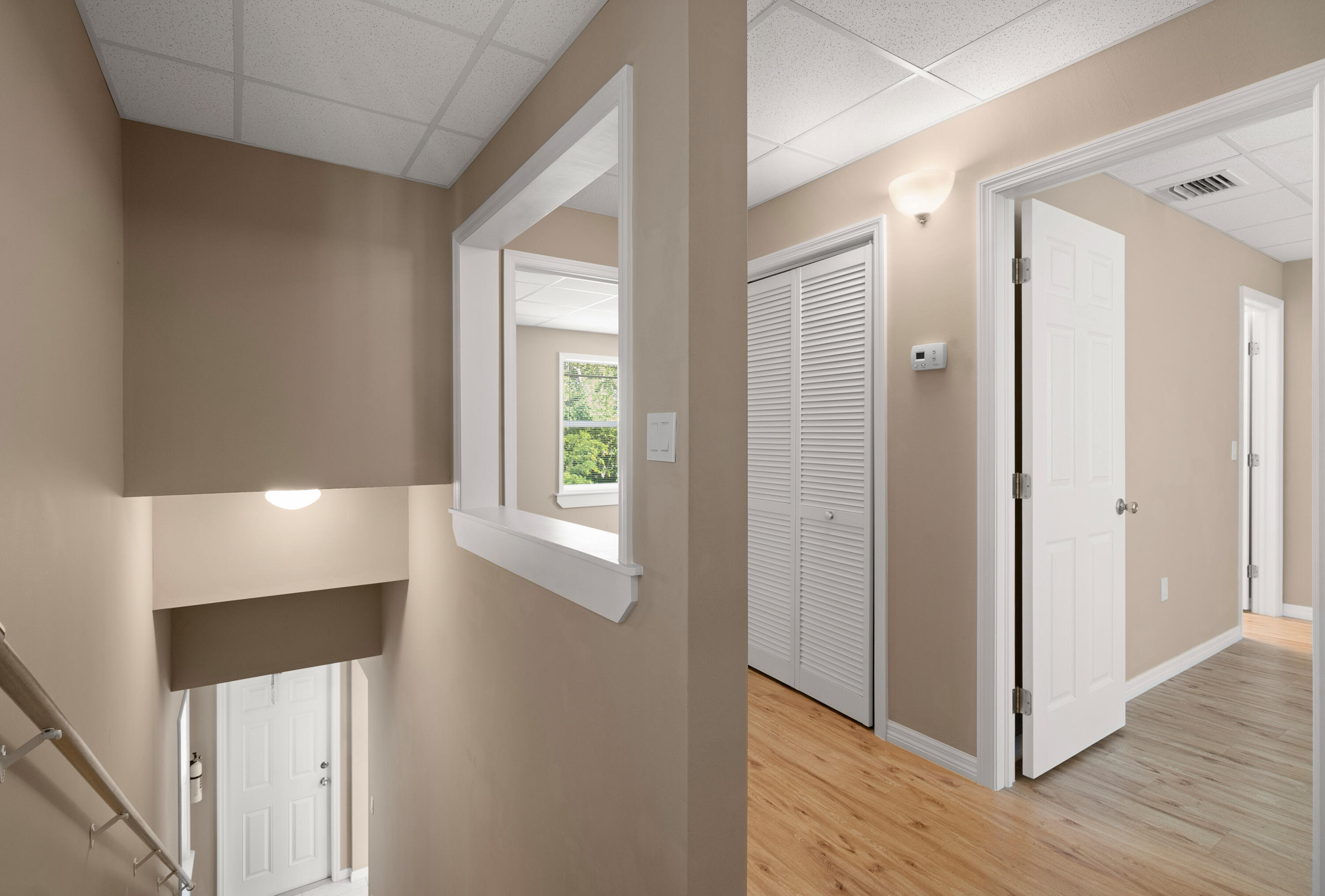 85 Holiday Boulevard Key Largo, FL 33037 - Photo 3 of 20 a view of hallway with window and wooden floor