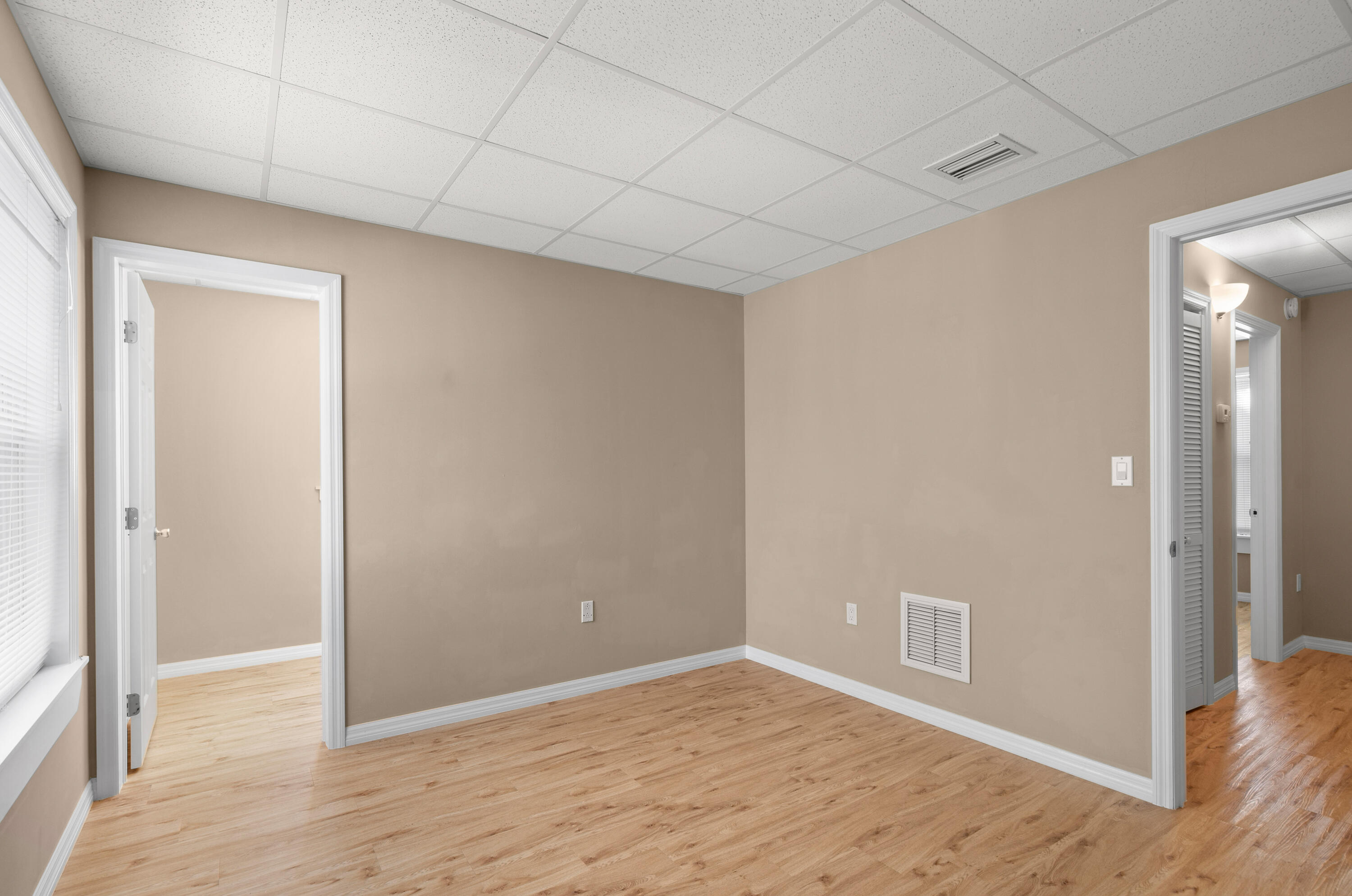 85 Holiday Boulevard Key Largo, FL 33037 - Photo 8 of 20 a view of an empty room with wooden floor