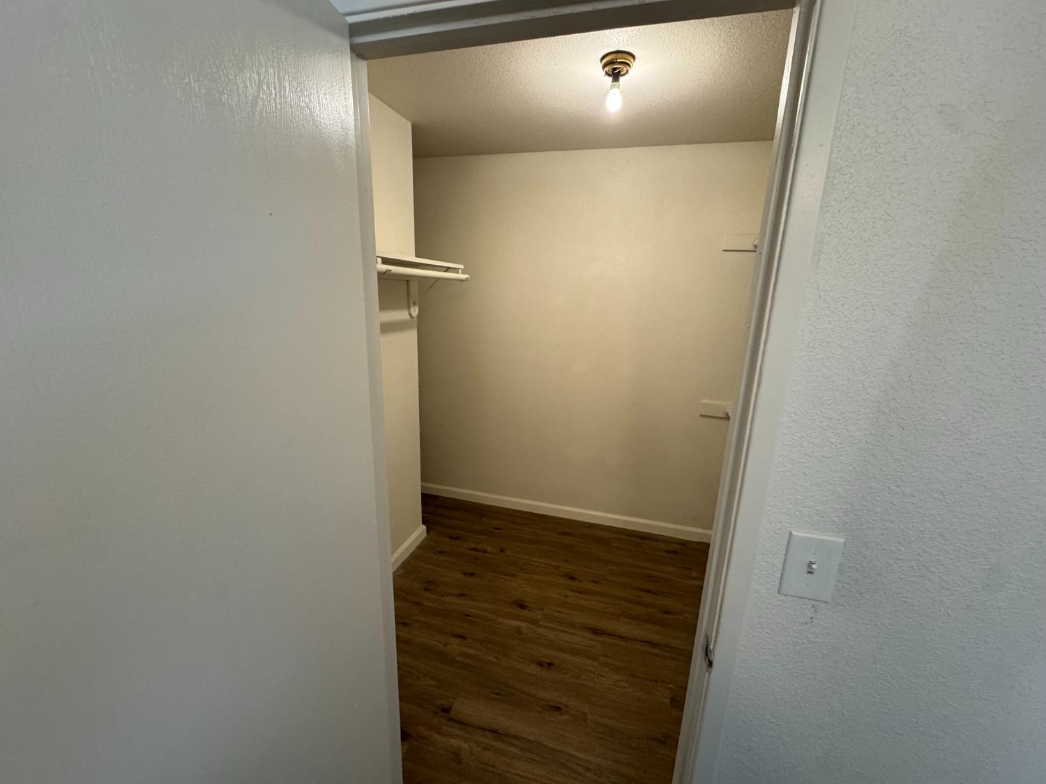 21293 East American Avenue Reedley, CA 93654 - Photo 11 of 19 a view of a hallway
