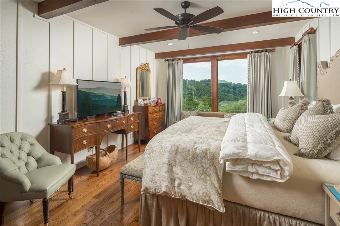 113 Pepperroot Road Boone, NC 28607 - Photo 15 of 50 a bedroom with a bed window and a flat screen tv