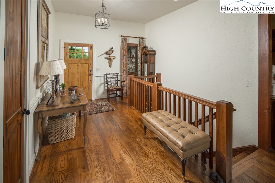 113 Pepperroot Road Boone, NC 28607 - Photo 18 of 50 a view of a hallway with wooden floor and windows