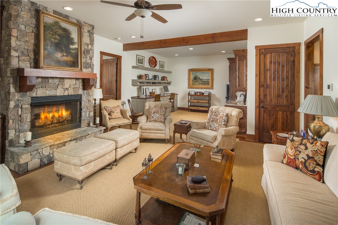 113 Pepperroot Road Boone, NC 28607 - Photo 19 of 50 a living room with furniture and a fireplace