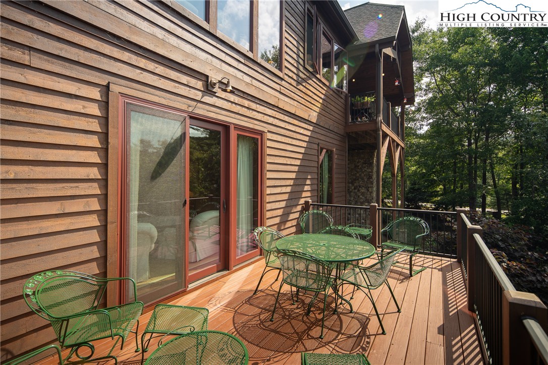 113 Pepperroot Road Boone, NC 28607 - Photo 24 of 50 a view of a chairs and table in the balcony