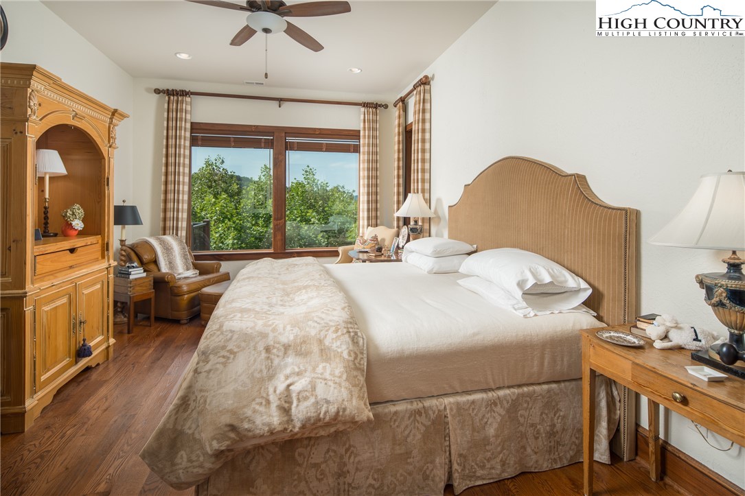 113 Pepperroot Road Boone, NC 28607 - Photo 25 of 50 a bedroom with a bed and a large window