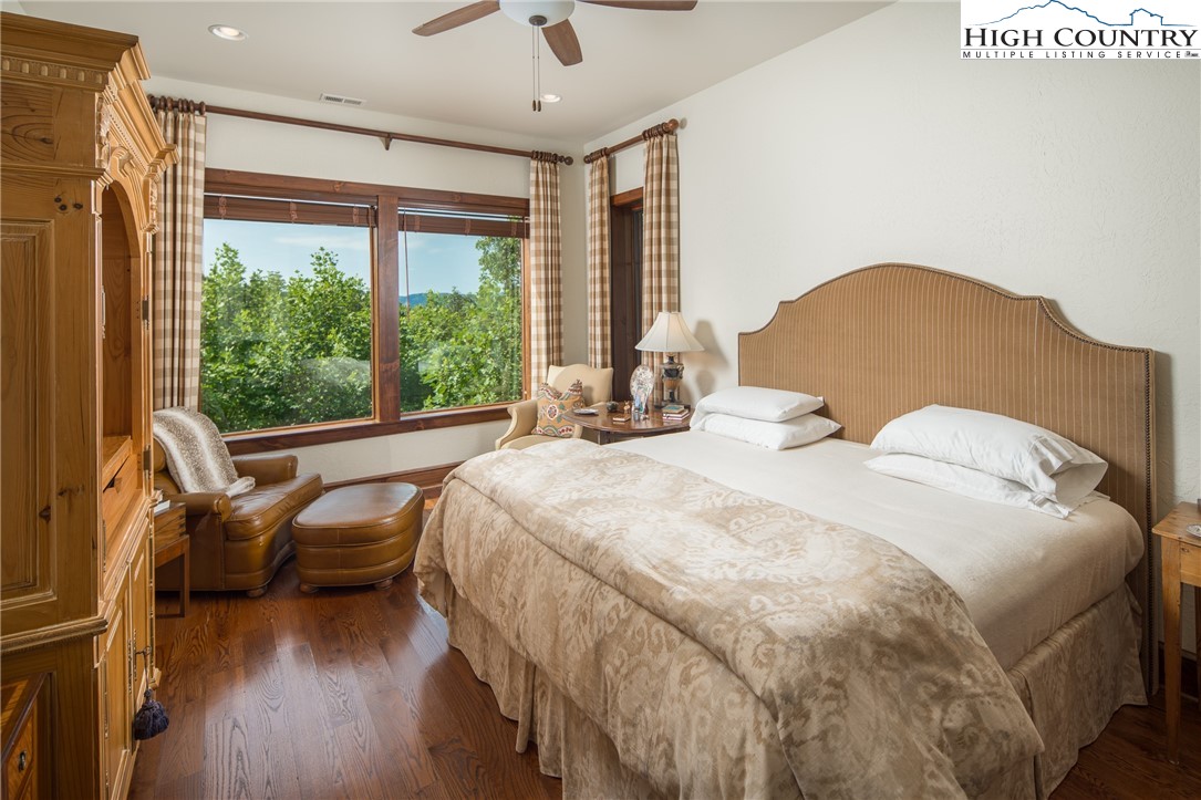 113 Pepperroot Road Boone, NC 28607 - Photo 26 of 50 a bedroom with a bed and a large window
