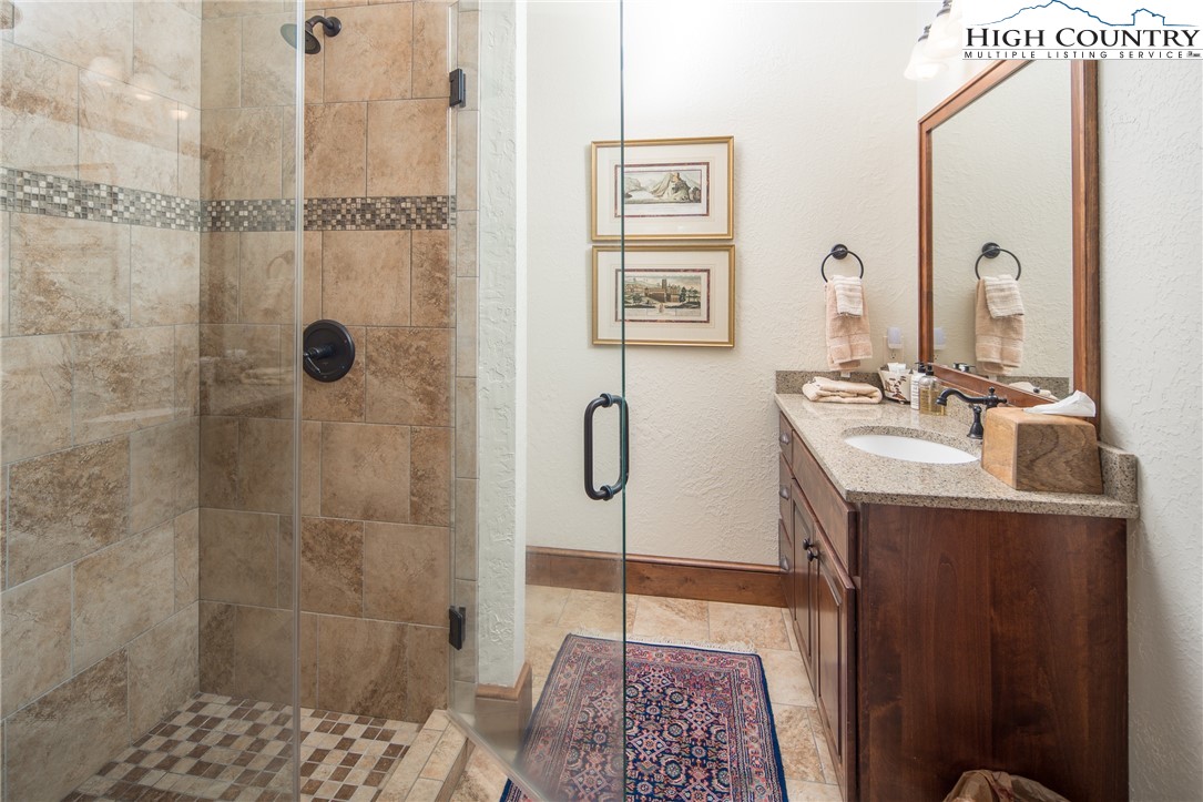 113 Pepperroot Road Boone, NC 28607 - Photo 27 of 50 a bathroom with a sink and mirror