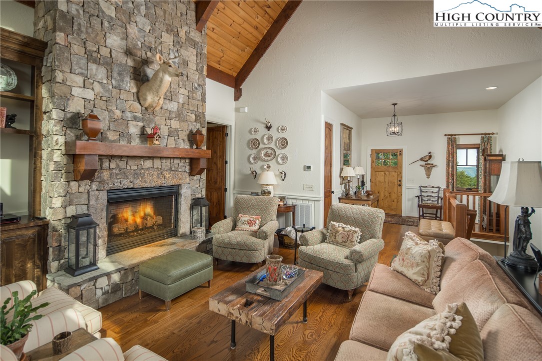 113 Pepperroot Road Boone, NC 28607 - Photo 4 of 50 a living room with furniture and a fireplace