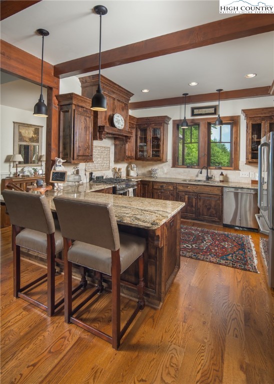 113 Pepperroot Road Boone, NC 28607 - Photo 6 of 50 a kitchen with a table chairs and wooden floor