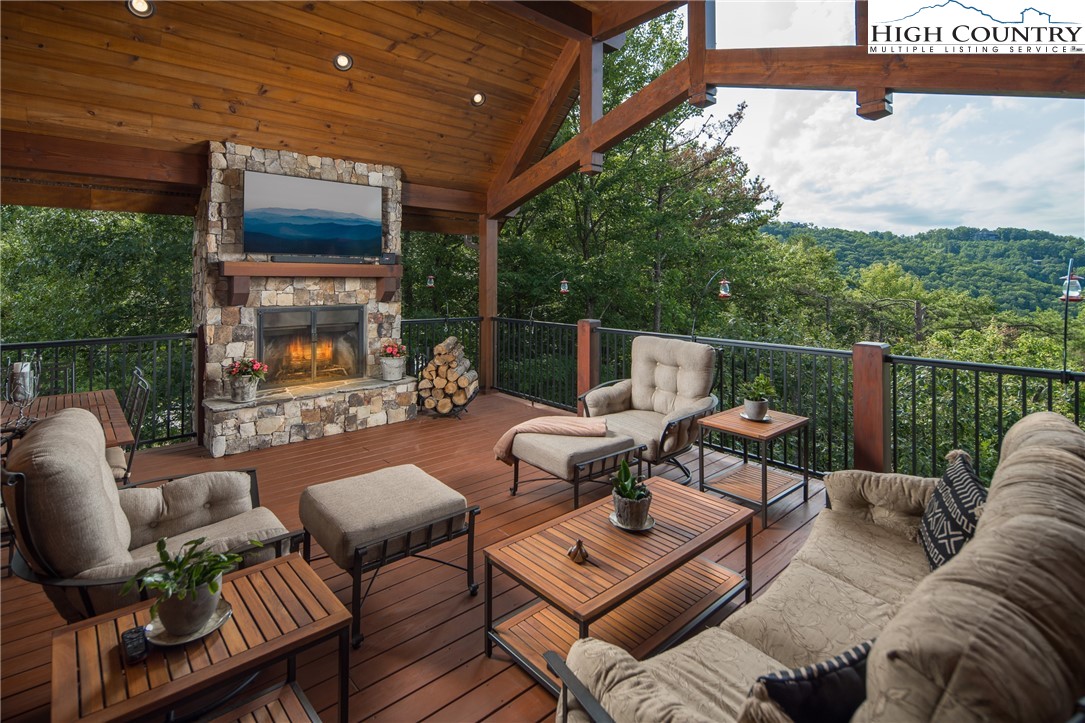 113 Pepperroot Road Boone, NC 28607 - Photo 10 of 50 a outdoor living space with furniture and a fireplace
