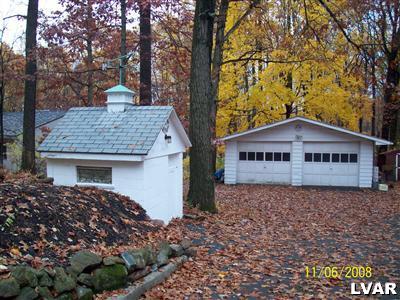 930 East Rock Road Allentown, PA 18103 - Photo 4 of 30 Well House to the LEFT and Oversized 2 Car garage straight ahead.