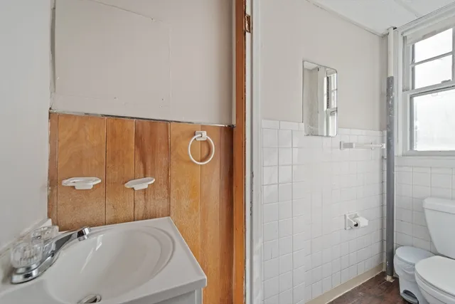 a bathroom with a sink and toilet