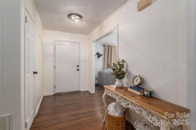 a view of an entryway with wooden floor