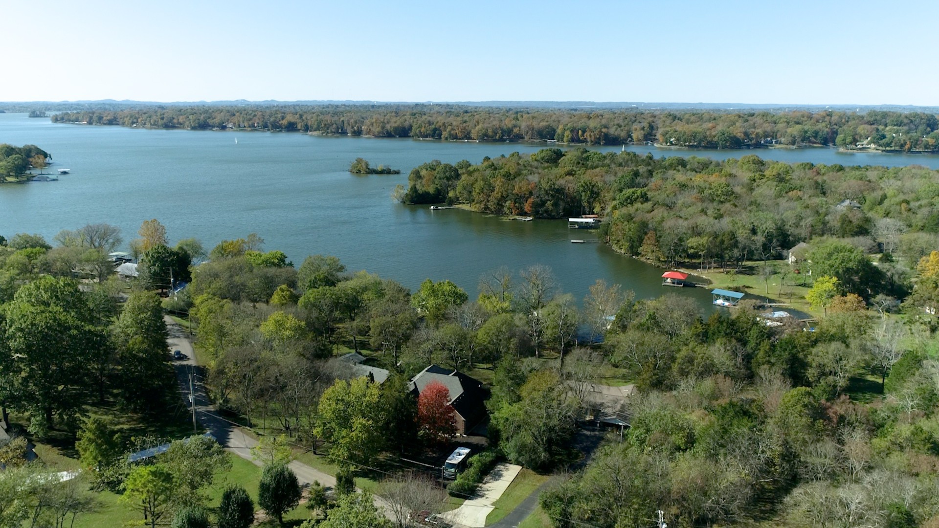 5514 Vanderbilt Road Old Hickory, TN 37138 - Photo 3 of 32 an aerial view of green landscape with trees houses and lake view