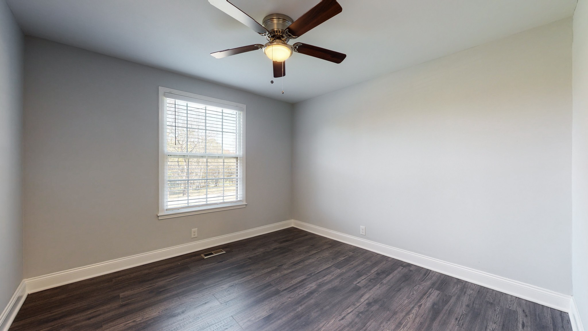 5514 Vanderbilt Road Old Hickory, TN 37138 - Photo 22 of 32 an empty room with wooden floor and windows