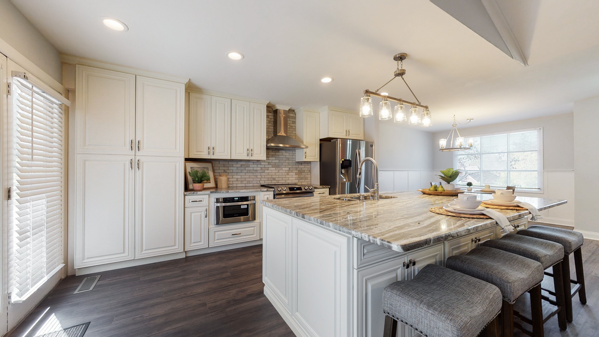 5514 Vanderbilt Road Old Hickory, TN 37138 - Photo 10 of 32 a kitchen with a stove a refrigerator and a table