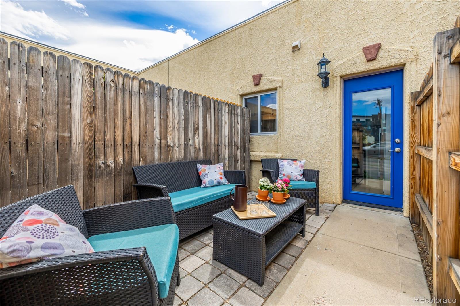 a outdoor living space with furniture and rug