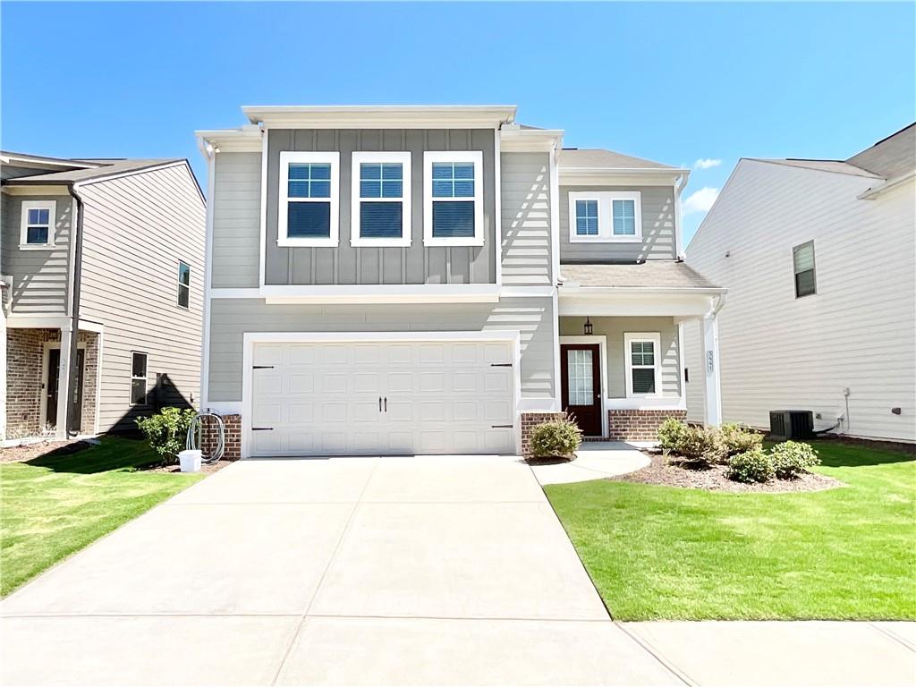 a front view of a house with a yard