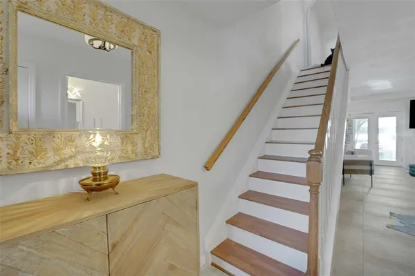 a view of entryway and hall with wooden floor