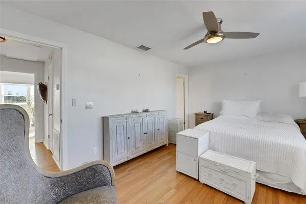 a bedroom with a bed and a couch