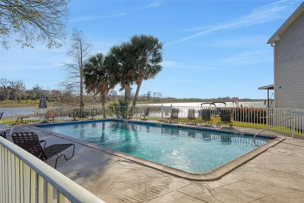 a view of swimming pool from a balcony