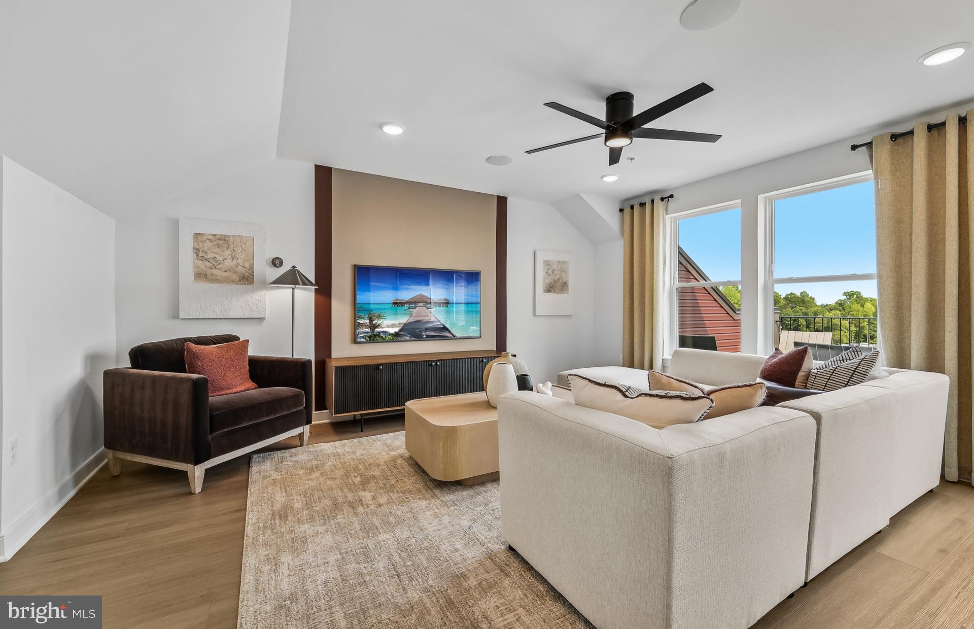 1311 Bracken Lane Laurel, MD 20724 - Photo 23 of 61 a living room with furniture and a flat screen tv