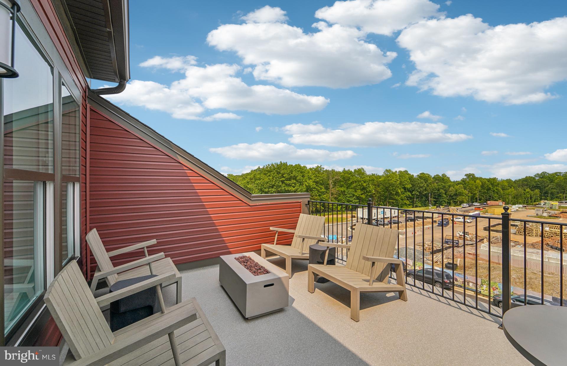 1311 Bracken Lane Laurel, MD 20724 - Photo 25 of 61 a view of a terrace with couches and sky view