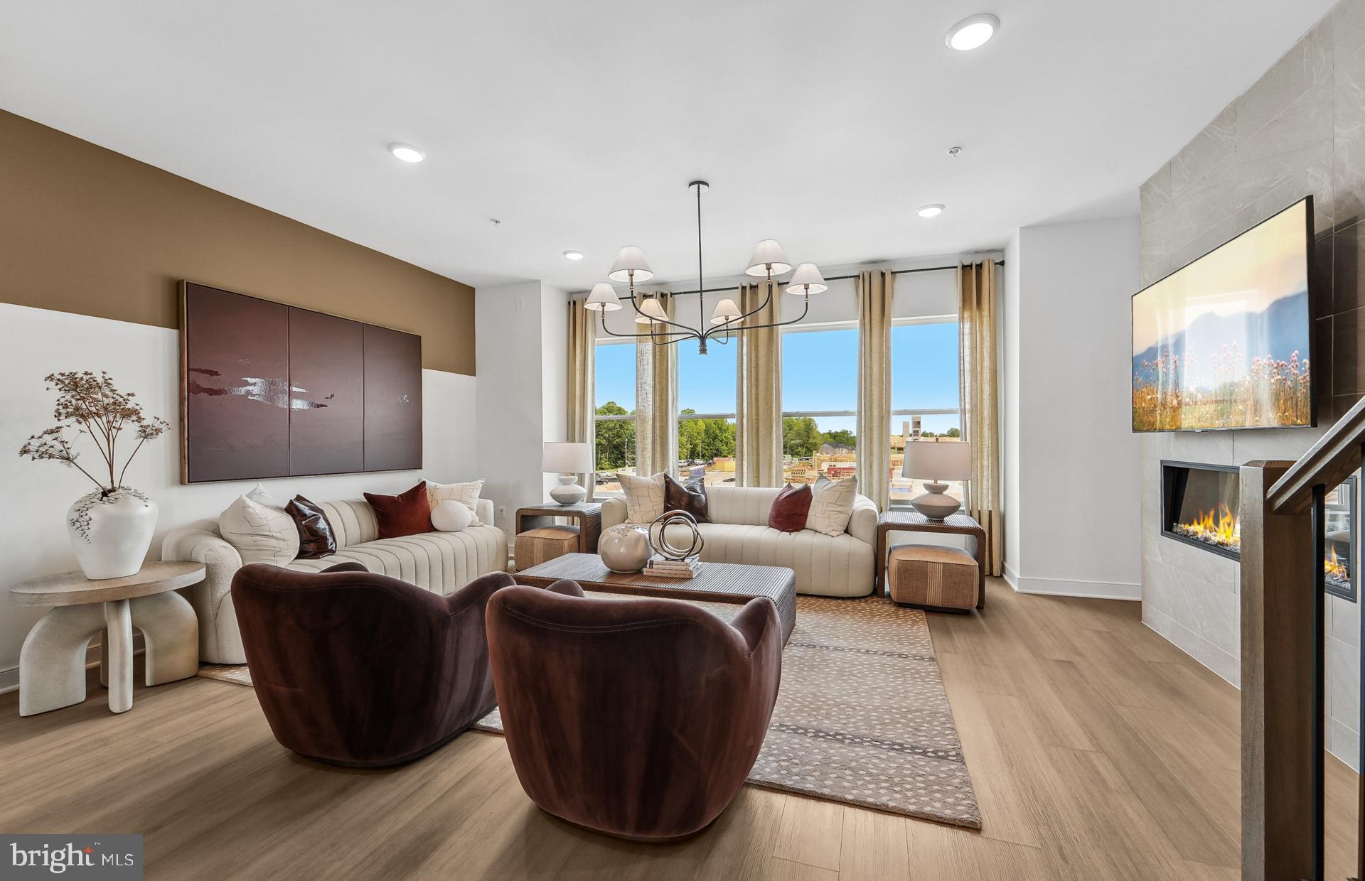 1311 Bracken Lane Laurel, MD 20724 - Photo 6 of 61 a living room with fireplace furniture and a flat screen tv
