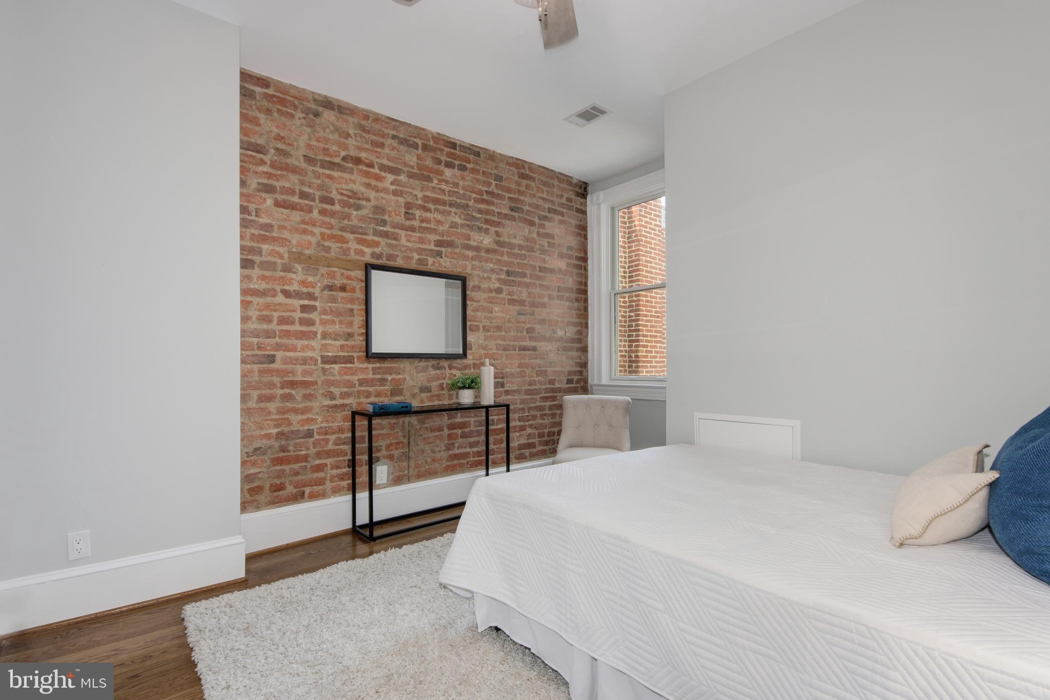 644 5th Street Northeast Washington, DC 20002 - Photo 21 of 51 Second bedroom with exposed brick wall