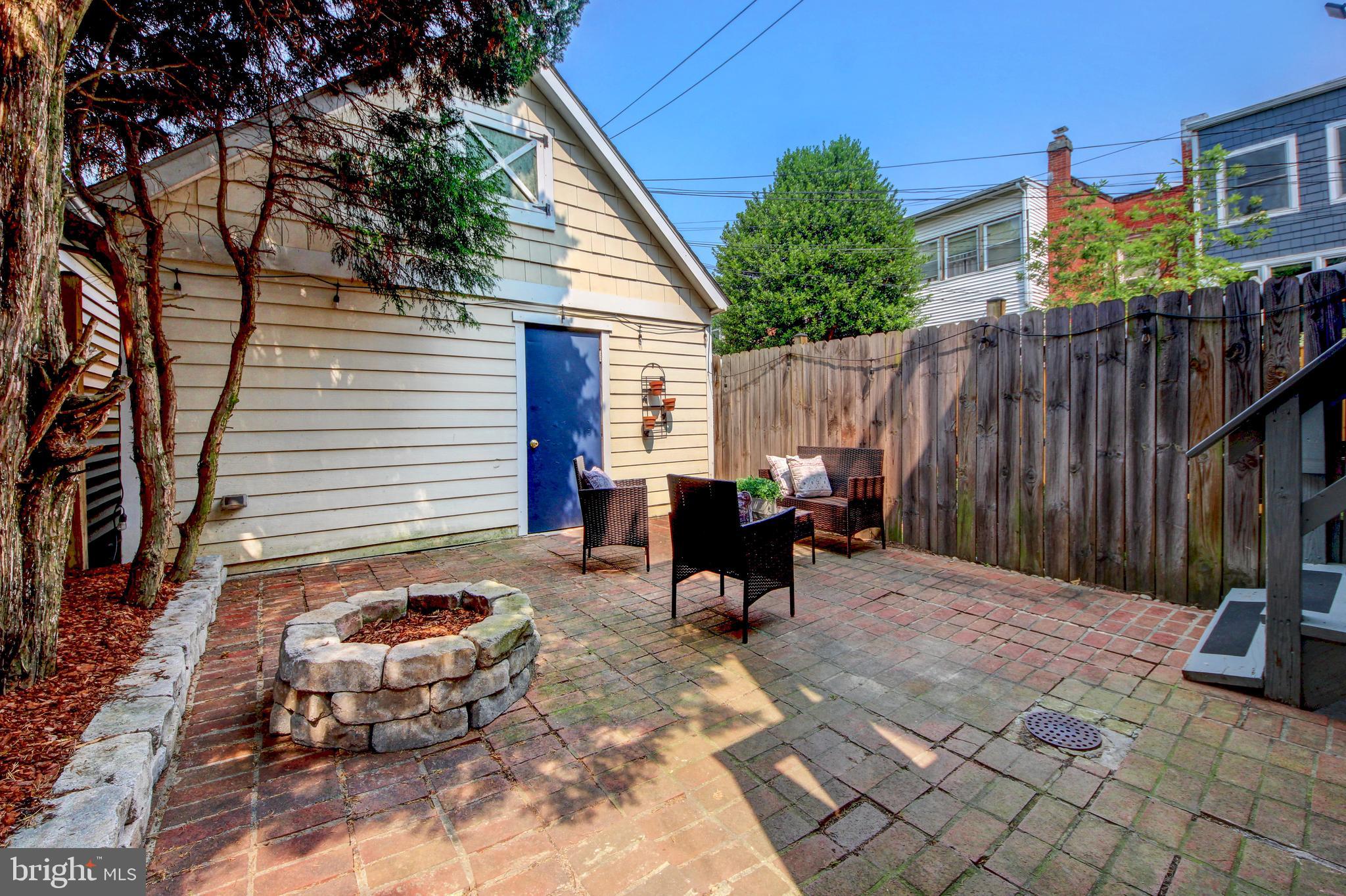 644 5th Street Northeast Washington, DC 20002 - Photo 32 of 51 Private courtyard with fire pit and brick patio