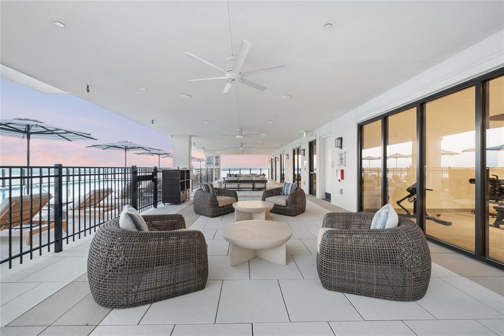 3111 Sunset Boulevard, Unit 915 Flower Mound, TX 75022 - Photo 30 of 39 a living room with furniture and a floor to ceiling window
