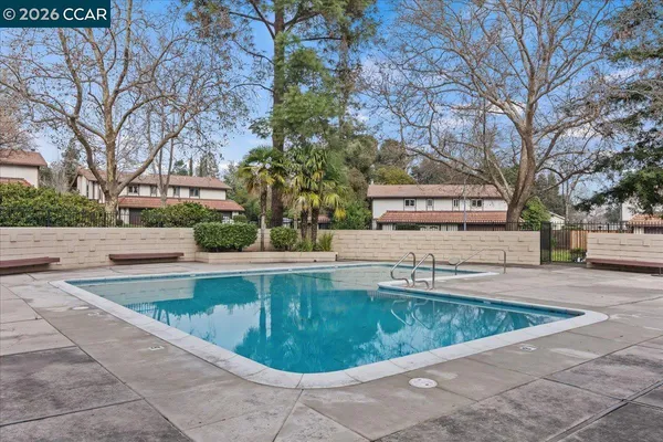 a view of a swimming pool with a sitting area
