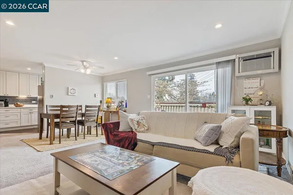 a living room with furniture and a table