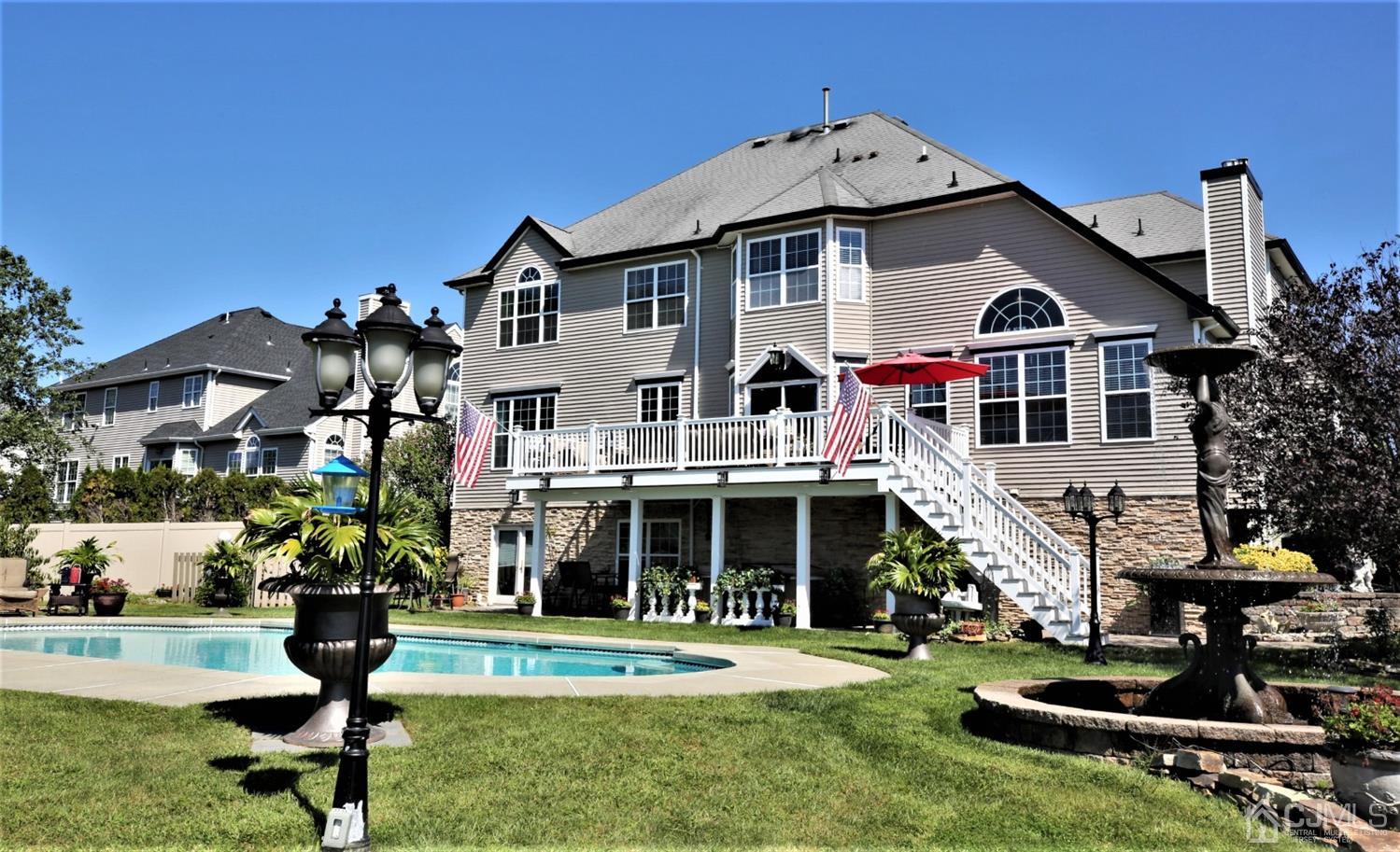 1 MacFarlane Circle Monroe Township, NJ 08831 - Photo 2 of 26 a front view of a house with garden