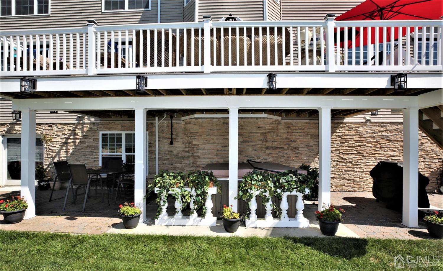 1 MacFarlane Circle Monroe Township, NJ 08831 - Photo 18 of 26 a backyard of a house with sofas