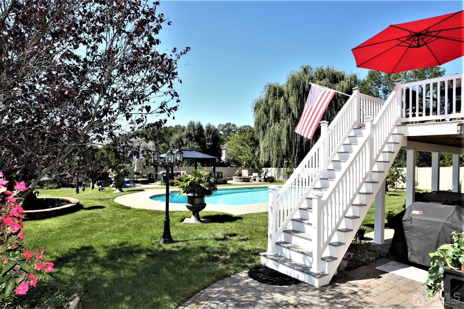 1 MacFarlane Circle Monroe Township, NJ 08831 - Photo 19 of 26 a view of a garden with an outdoor space